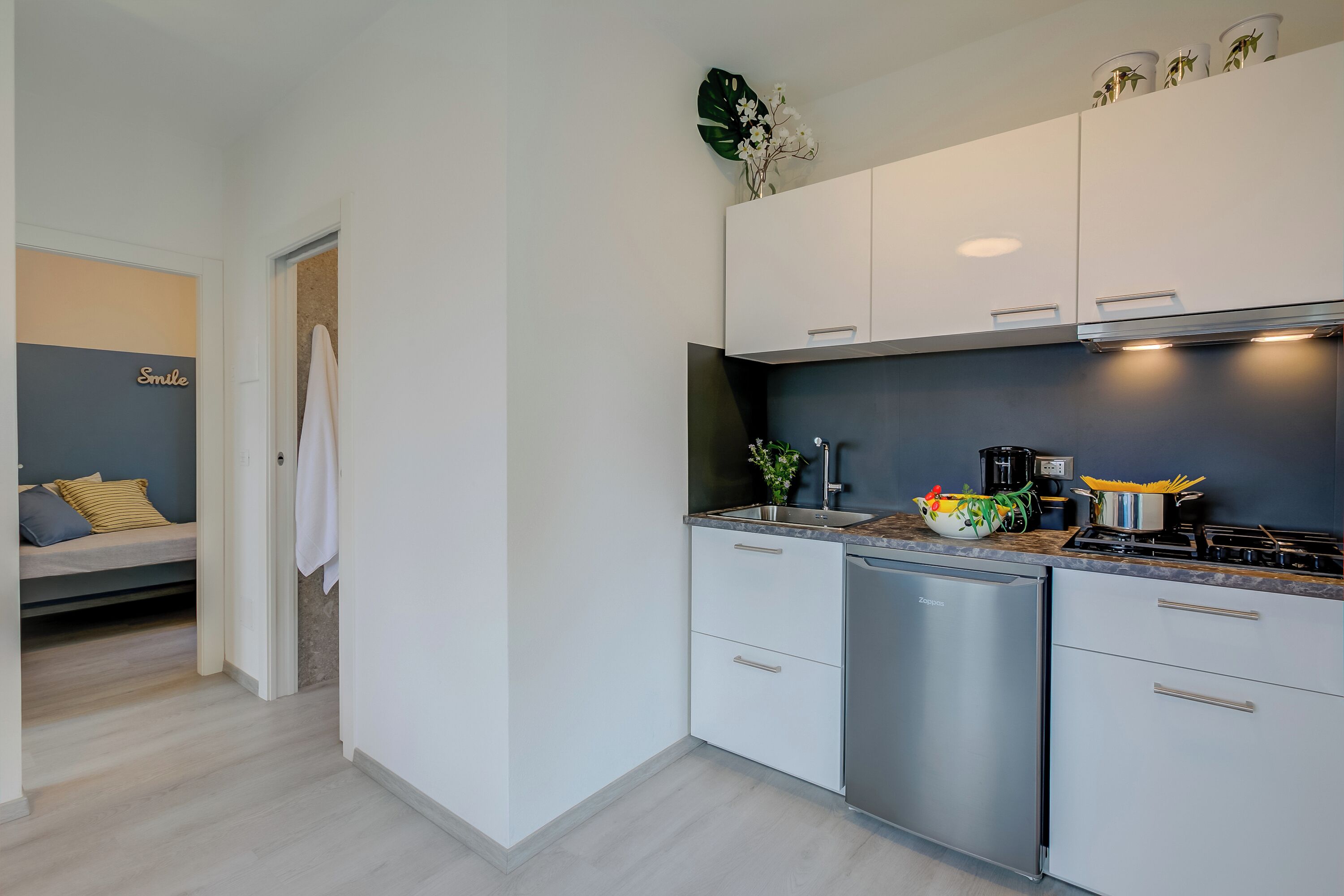 Family House, Multiple Bedrooms (Relais Nanzello Garda Living 1) | Private kitchen | Fridge, microwave, stovetop, coffee/tea maker
