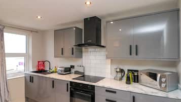 Fridge, electric kettle, toaster, cookware/dishes/utensils