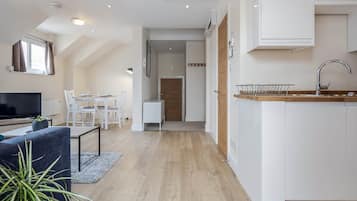 Standard Apartment | Living area | 43-inch Smart TV with digital channels, Netflix, streaming services