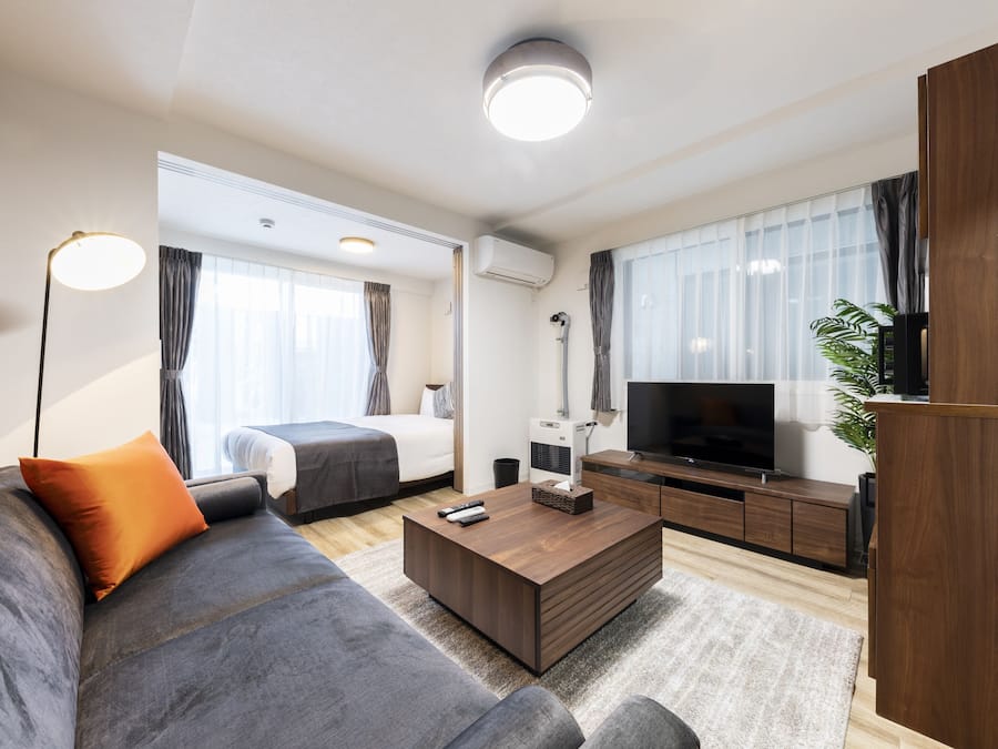 Business Apartment | Living area | Flat-screen TV