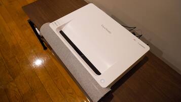 A white ViewSonic monitor on a wooden table.
