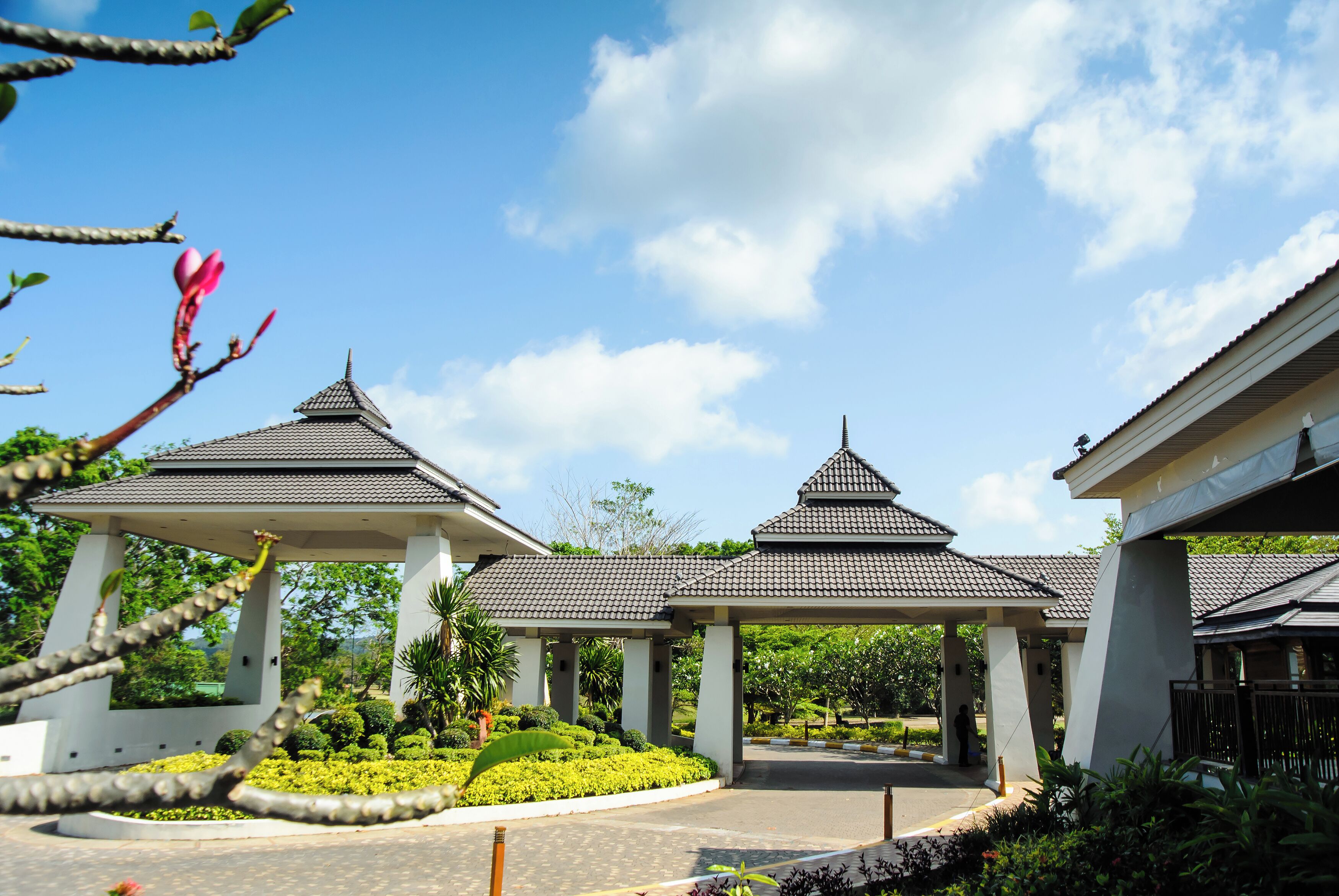 A traditional-style building with multiple pavilions and a well-maintained garden area.