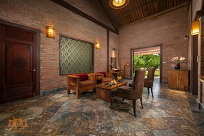 Grand Suite Bungalow Double with Garden View and Onsen | Living area | 55-inch flat-screen TV with premium TV channels - Asean Resort - Shiki Onsen & Spa (Hanoi)