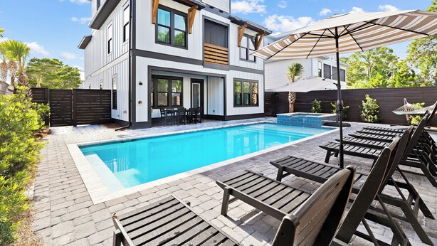 A modern two-story house with a swimming pool, outdoor seating, and a well-maintained garden. - Diamond Oasis | Private Pool/Spa | Arcade Games | Private Beach Access (Miramar Beach)