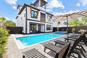 A modern two-story house with a swimming pool, outdoor seating, and a well-maintained garden. - Diamond Oasis | Private Pool/Spa | Arcade Games | Private Beach Access (Miramar Beach)
