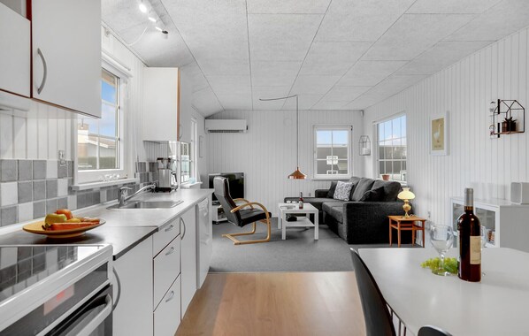 Fridge, stovetop, dishwasher, coffee/tea maker