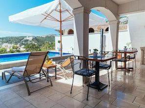 Seasonal outdoor pool, pool umbrellas, pool loungers