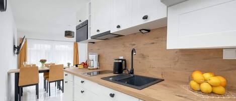 Fridge, microwave, stovetop, coffee/tea maker