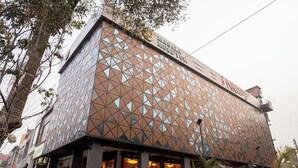 A building with a geometric facade, a sign reading "MASALA MUSEUM," and a visible entrance. - Pink Mango A Boutique Hotel (Hisar)