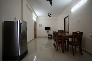 Deluxe Apartment | Living area | 32-inch LCD TV with cable channels - Aishwaryam Service Apartment (Chennai)