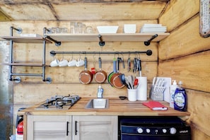 Fridge, stovetop, coffee/tea maker, cookware/dishes/utensils