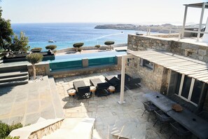 Outdoor dining - 2 Bedroom Villa with Private  Glass Pool & Shared Infinity Pool, Gym, Pool Bar (Mykonos)
