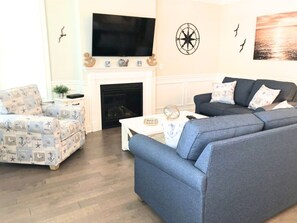 TV, fireplace, books