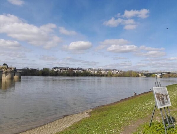 Enjoy serene views of the river and surrounding landscape from this riverside retreat.