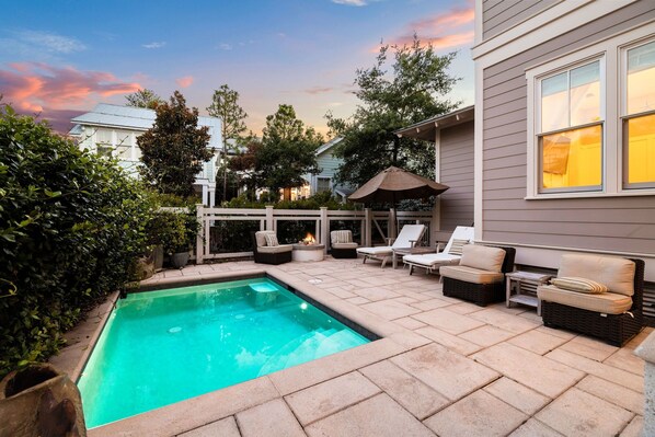 A backyard with a swimming pool, outdoor seating, and a fire pit. - Office Space | Private Pool | LSV | Firepit (Santa Rosa Beach)