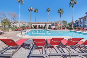 A pool area with red lounge chairs and a clear blue pool. - Pool Access, Near Spring Training! Mesa Retreat (Mesa)