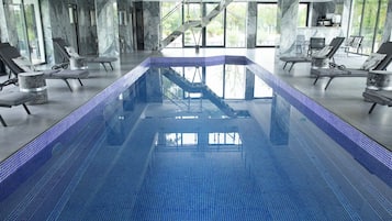 Indoor pool, open 8:00 AM to 9:00 PM, pool loungers