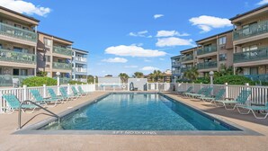 A swimming pool with a 3ft no diving sign, surrounded by lounge chairs and a white fence. - Oceanfront View @ A Place at the Beach 3 1I (Myrtle Beach)