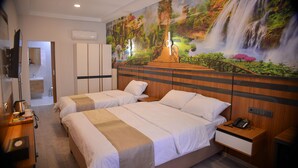 A hotel room with two beds, a wooden headboard, a nightstand with a phone, and a mural of a waterfall. - Vizyon Life Pansiyon (Elazig)