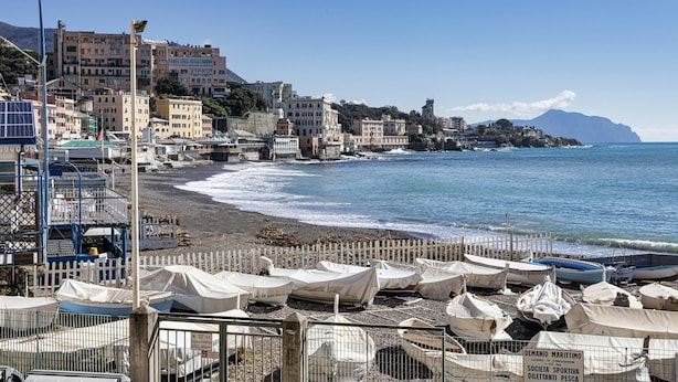 A coastal town with boats on the beach and buildings along the shore. - Casa Camilla al Mare by Wonderful Italy (Genoa)