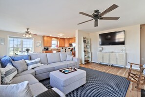 Smart TV, fireplace, books, computer monitors