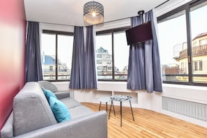 Comfort Apartment, City View | Living area | TV