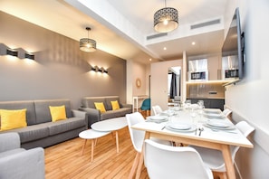 Family Apartment, City View | Living area | TV - Residence Paris Helder (Paris)