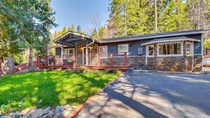 A lodge with a stone exterior, a covered porch, and a stone fireplace. - Lake Access & Hot Tub: Pet-Friendly Arnold Home (Arnold)