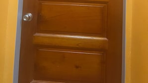 A wooden door with the number 5 on it. - Aqua Lounge The Venue (Sangre Grande)