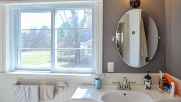 Shower, hair dryer, towels, toilet paper