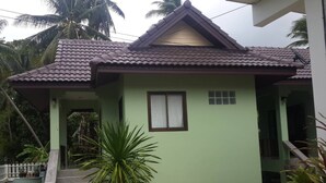 A single-story house with a tiled roof, a front porch, and a small window. - Private house one bedroom, full furniture, small kitchen, 5 minutes to the beach (Koh Samui)