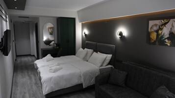 Standard Triple Room | Minibar, in-room safe, desk, laptop workspace