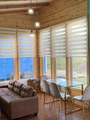 Basic Cottage | Living area | Flat-screen TV - Cabañas Arte Brisa Patagonia (Natales)