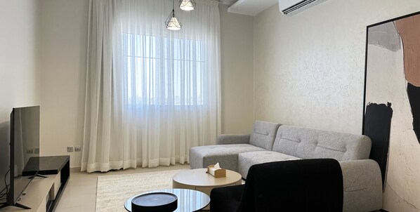 Design Apartment, 3 Bedrooms | Living area | 55-inch Smart TV with cable channels - Kease Qurtubah A-2 Royal Design AZ48 (Riyadh)