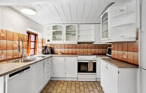 Fridge, stovetop, dishwasher, coffee/tea maker