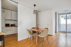 Enjoy meals on the balcony or dine in the room at the round dining table.