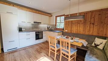 Oven, dishwasher, toaster, dining tables