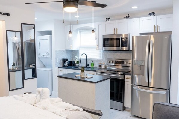 Fridge, microwave, stovetop, coffee/tea maker