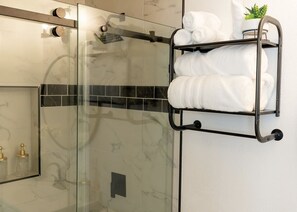 Hair dryer, towels, shampoo, toilet paper