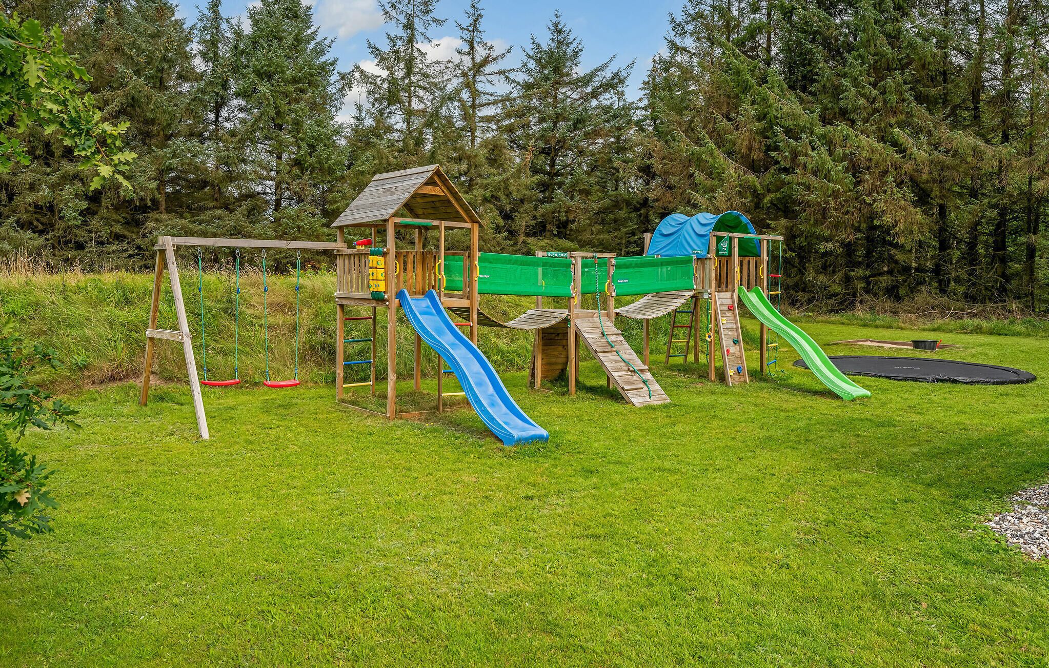 A playground with slides and climbing structures.