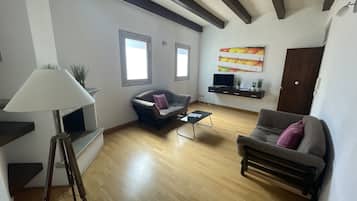 Superior Apartment | Living area | 32-inch Smart TV with digital channels