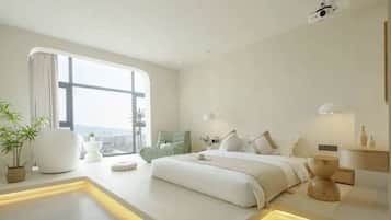 A modern bedroom with a large window, a bed with white bedding, a bedside table, and a small plant.