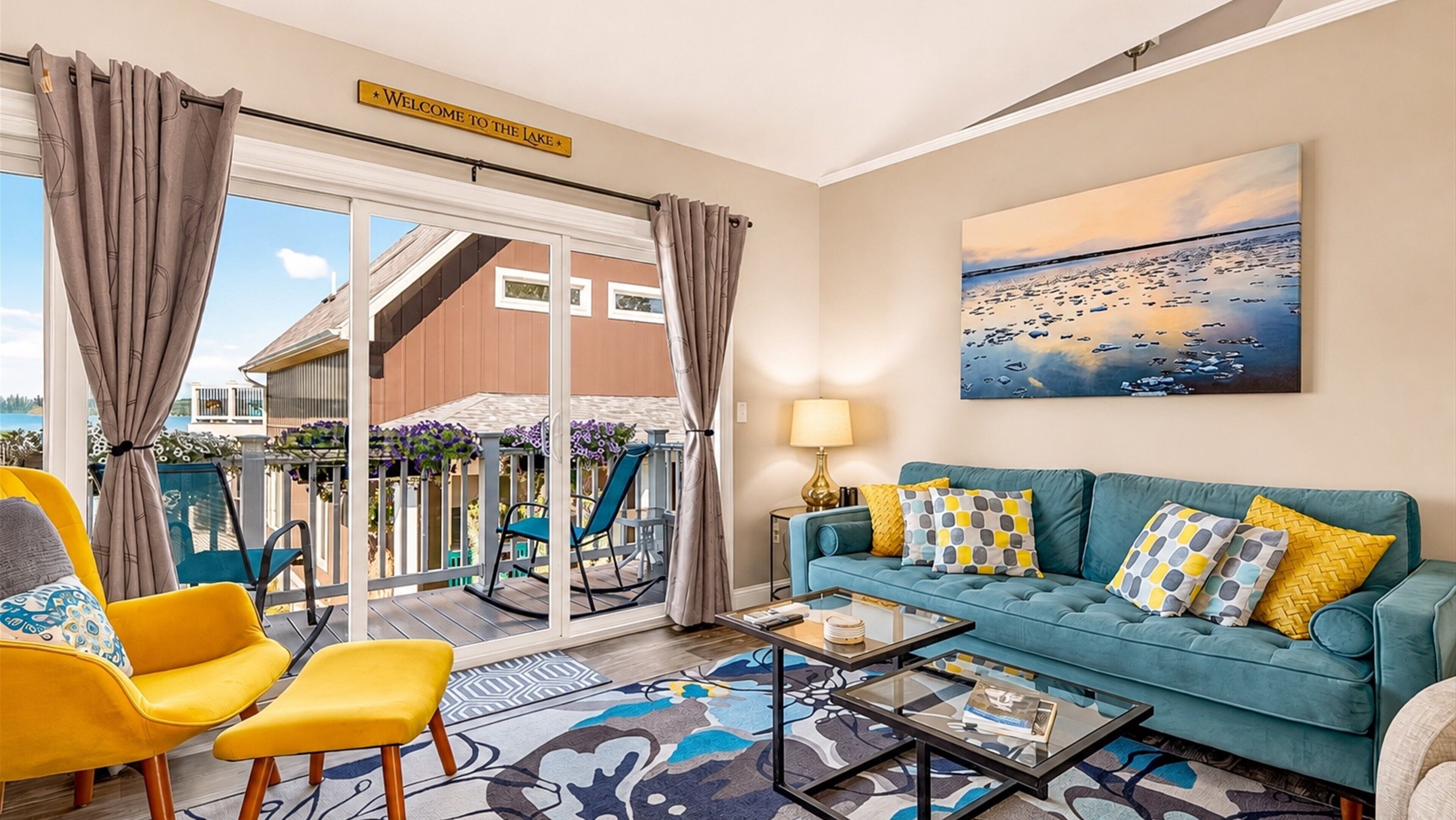 Welcome to the lake — sink into the sofa or step out to the deck.