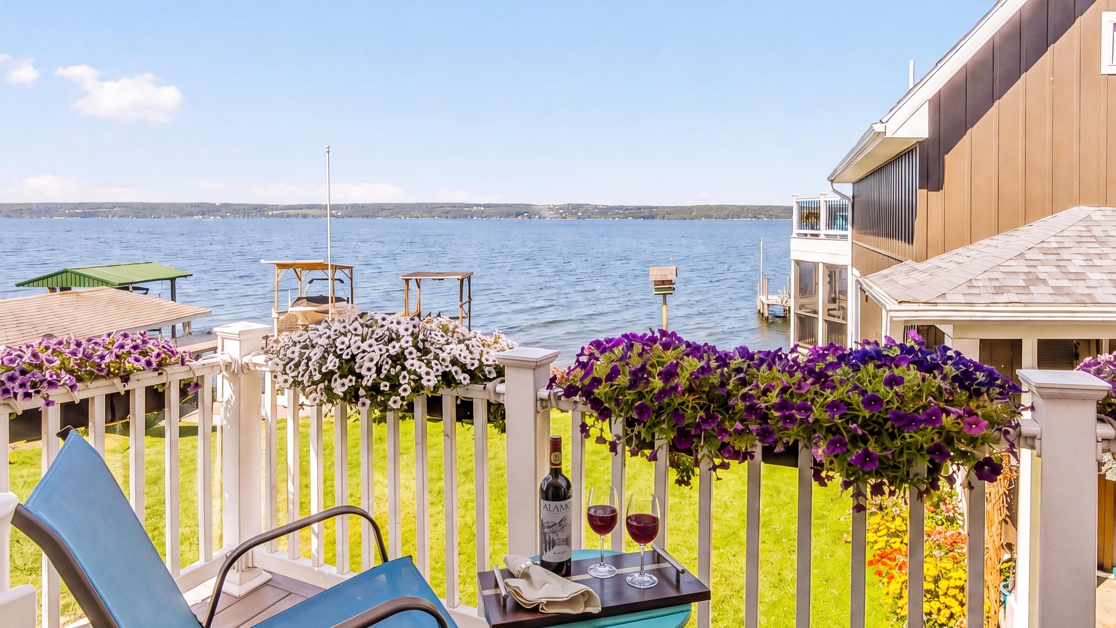 Two glasses and a lake view with time to relax and enjoy. 