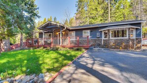 A lodge with a stone exterior, a covered porch, and a stone fireplace. - Lake Access & Hot Tub: Pet-friendly Arnold Home (Arnold)