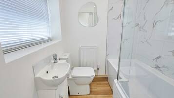 Shower, hair dryer, towels, shampoo