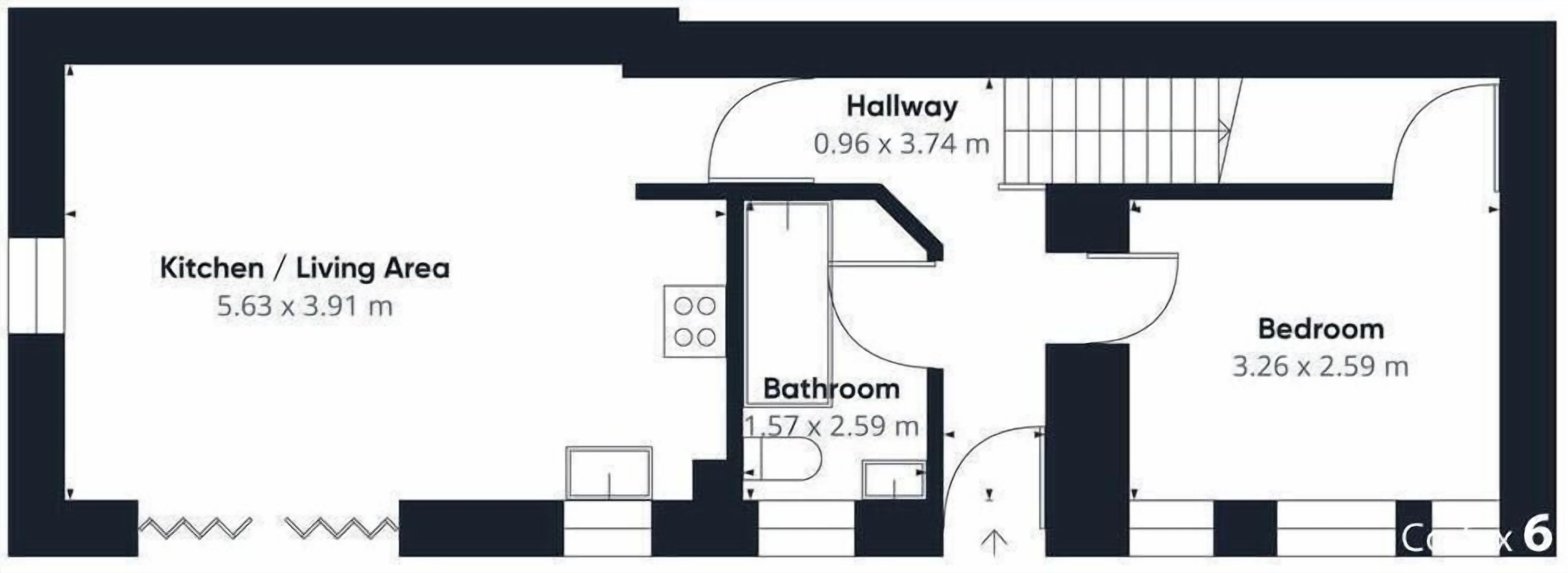 Pianta dei locali con cucina/zona giorno (5,63 x 3,91 m), bagno (1,57 x 2,59 m), disimpegno (0,96 x 3,74 m) e camera da letto (3,26 x 2,59 m).