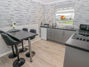 Fridge, electric kettle, toaster, cookware/dishes/utensils - 48 Gower Holiday Village (Swansea)