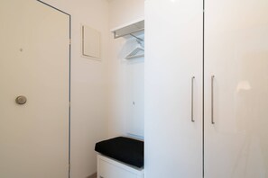 Enjoy a refreshing shower in this bathroom with a walk-in shower, ample storage, and convenient amenities.