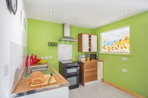 Fridge, oven, cookware/dishes/utensils